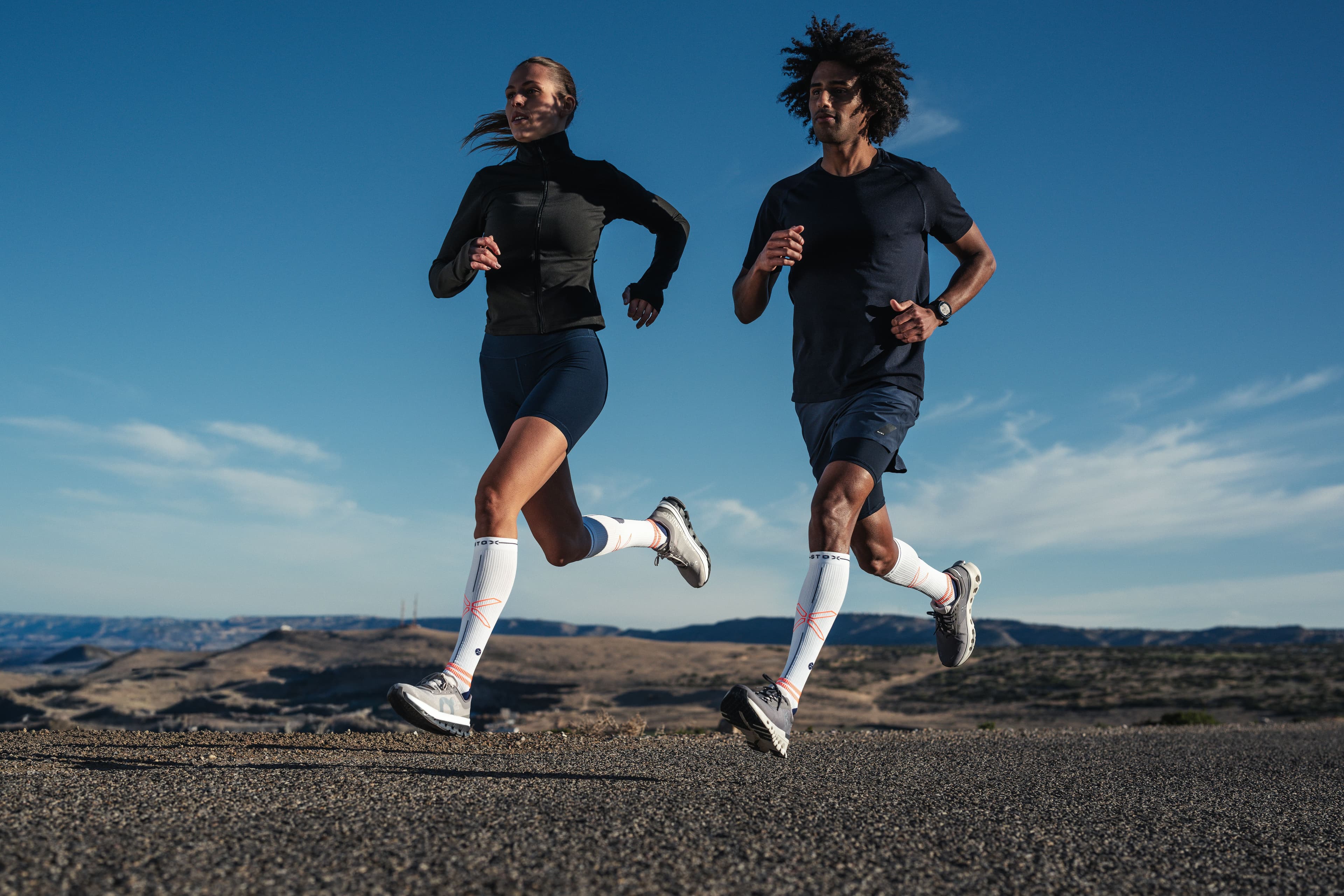 2 runners with emphasize on their STOX socks
